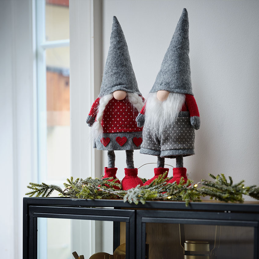 Christmas gnomes and Christmas elves on top of sideboard