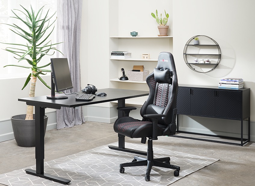 Home office with height adjustable desk and gaming chair